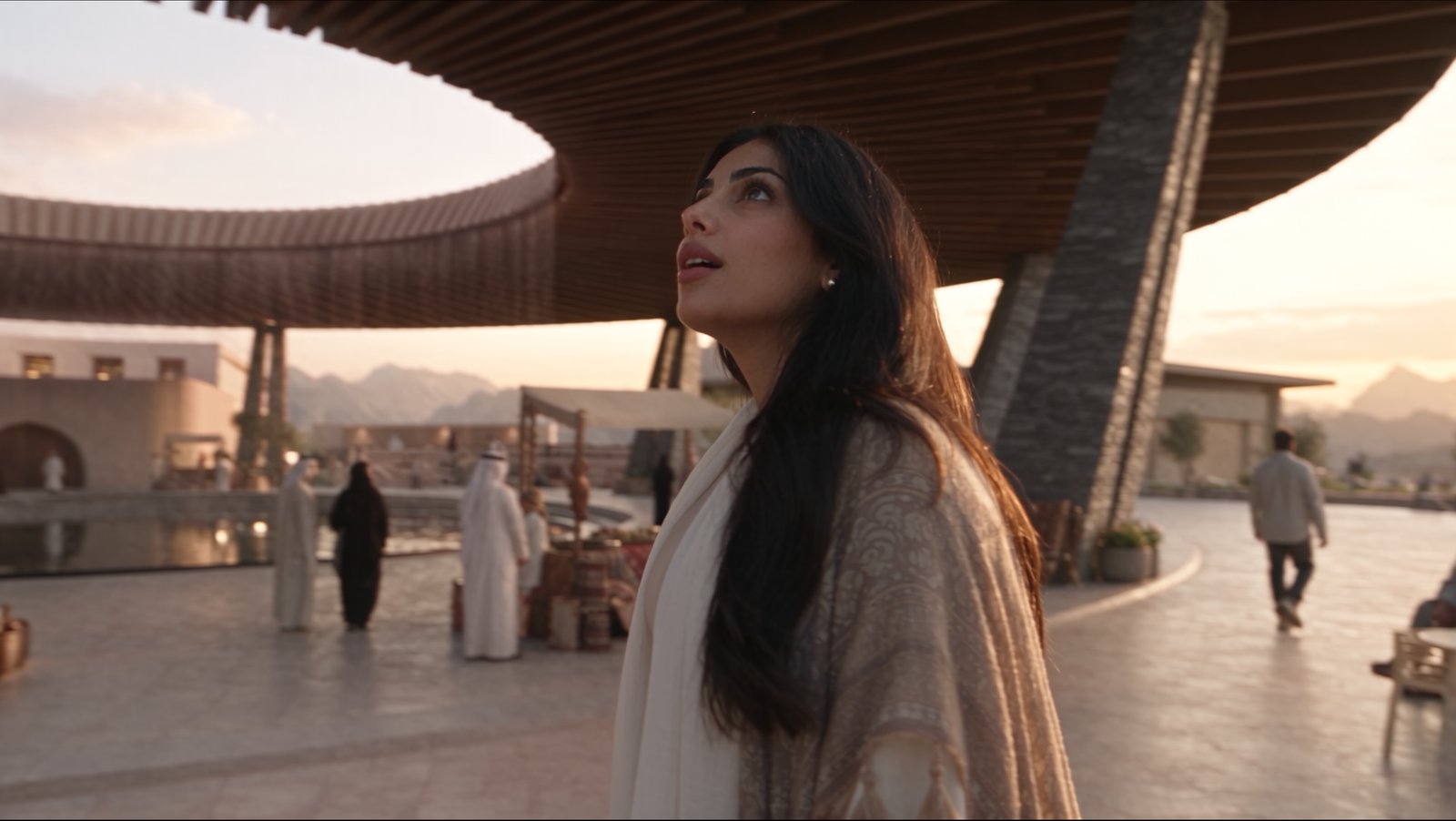 Skywell film still — the same courtyard, Amira looking up through the oculus